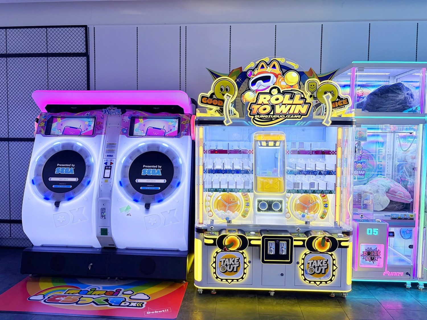 Arcade games including a SEGA rhythm game and a Roll to Win prize machine